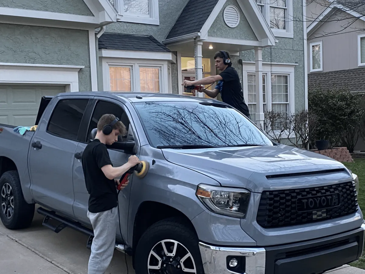 Aqulux team polishing a grey Toyota Tundra truck